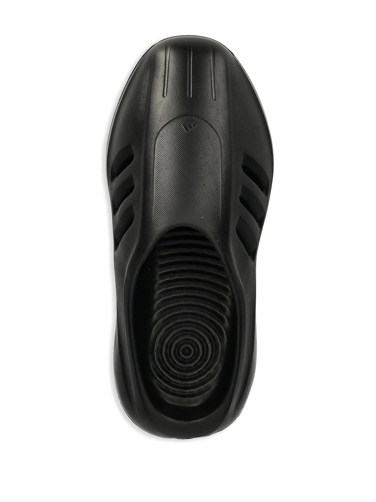 Black slip-on shoe with textured sole on a white background