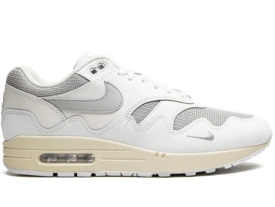 White sneaker with beige sole on a white background
