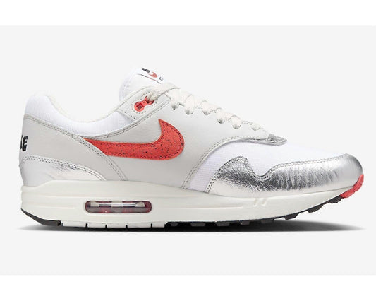 White sneaker with red swoosh logo on a white background