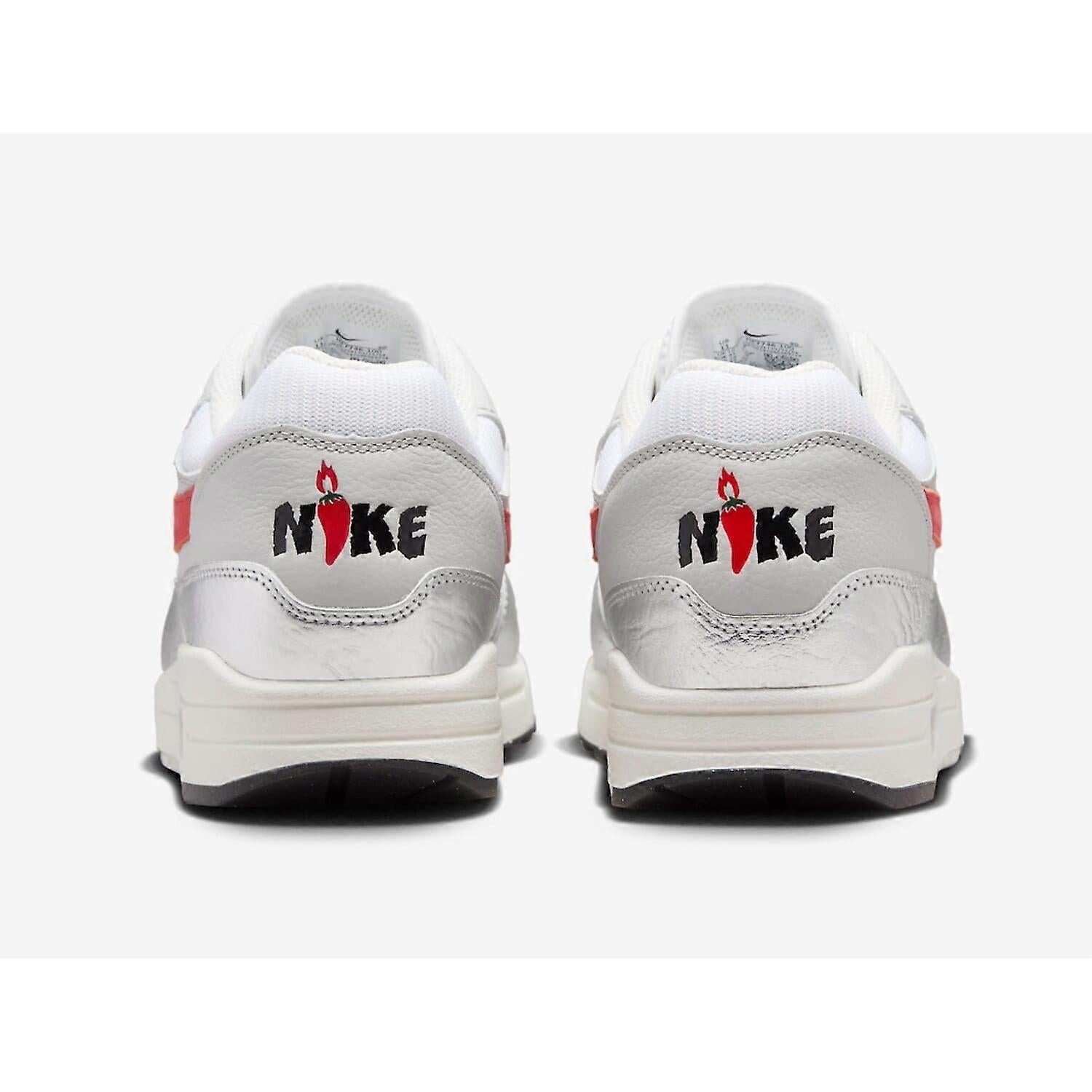 White sneakers with red and black Nike logo on a white background