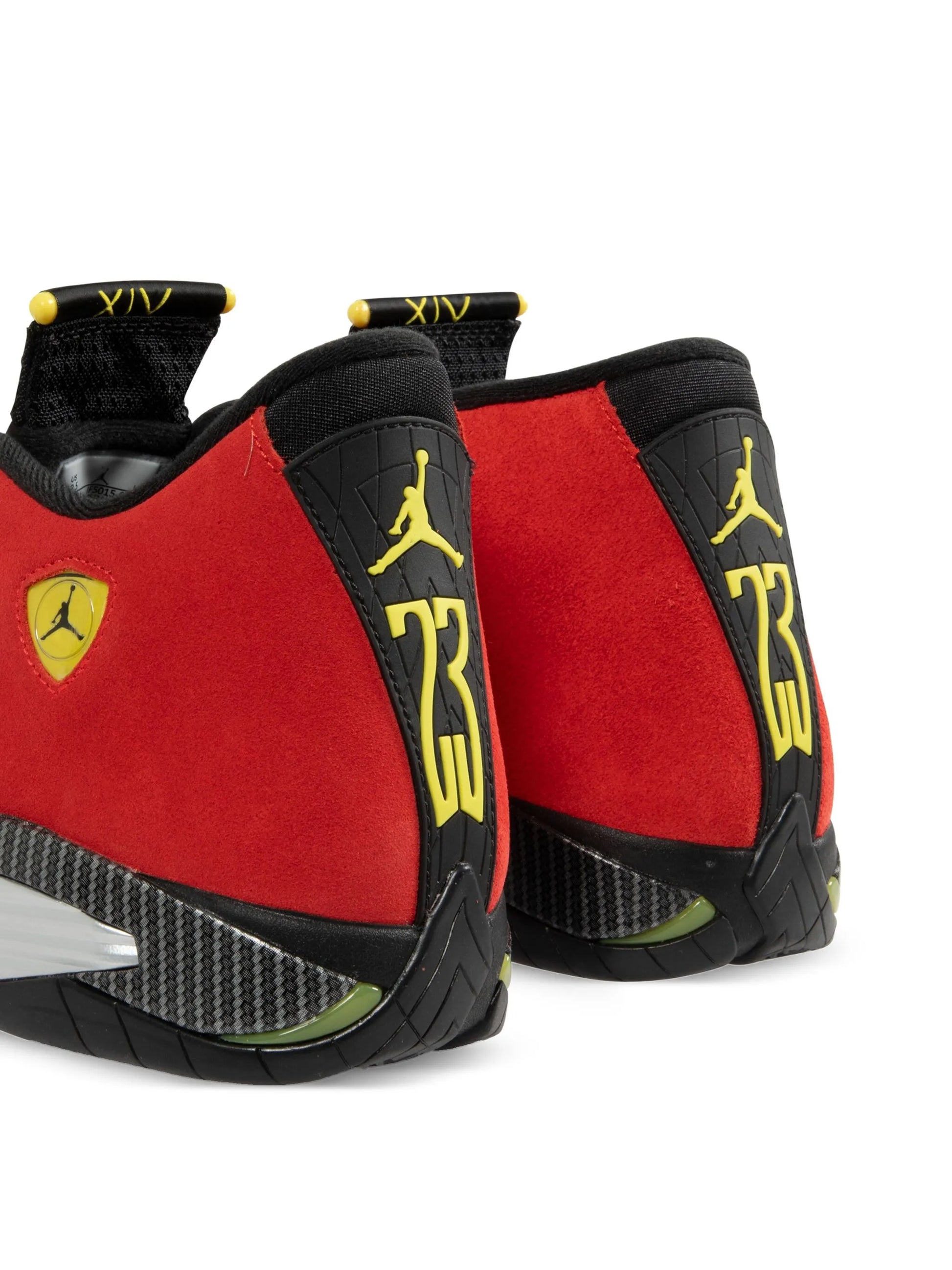 Red and black sneakers with yellow accents on a white background