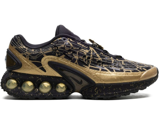 Black and gold sneaker with unique sole design on a white background