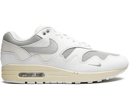 White sneaker with beige sole on a white background