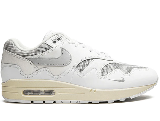 White sneaker with beige sole on a white background