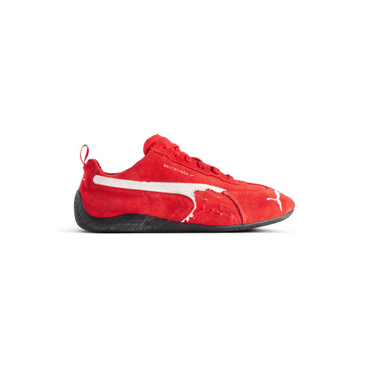 Red sneaker with a white logo on a white background