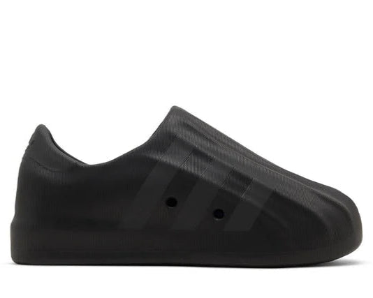 Black slip-on shoe on a white background