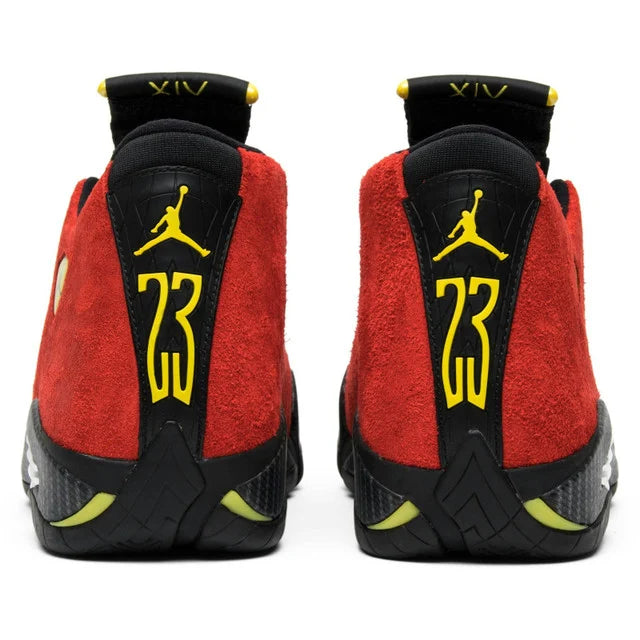 Red and black sneakers with yellow accents on a white background