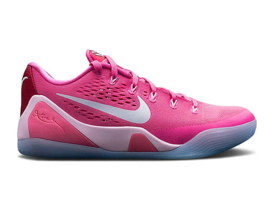 Pink athletic shoe with white accents on a white background